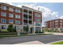 210-175 Commonwealth Street, Kitchener, ON  - Outdoor With Balcony With Facade 