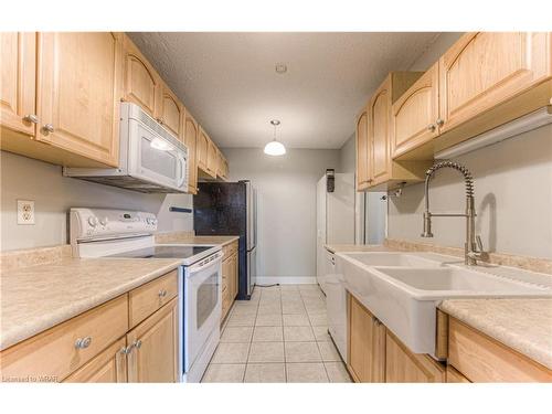 810-225 Harvard Place, Waterloo, ON - Indoor Photo Showing Kitchen With Double Sink