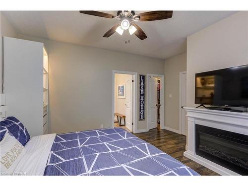 76 Kennedy Road, Breslau, ON - Indoor Photo Showing Bedroom With Fireplace