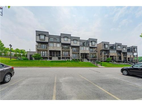 64F-1989 Ottawa Street S, Kitchener, ON - Outdoor With Balcony With Facade