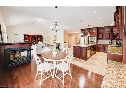 44-260 Deer Ridge Drive, Kitchener, ON - Indoor Photo Showing Dining Room With Fireplace