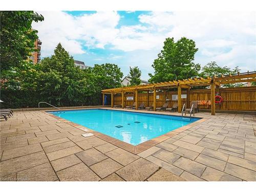 1112-2325 Central Park Drive, Oakville, ON - Outdoor With In Ground Pool With Backyard