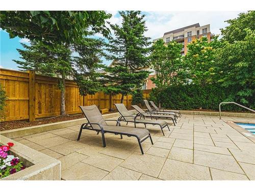 1112-2325 Central Park Drive, Oakville, ON - Outdoor With In Ground Pool