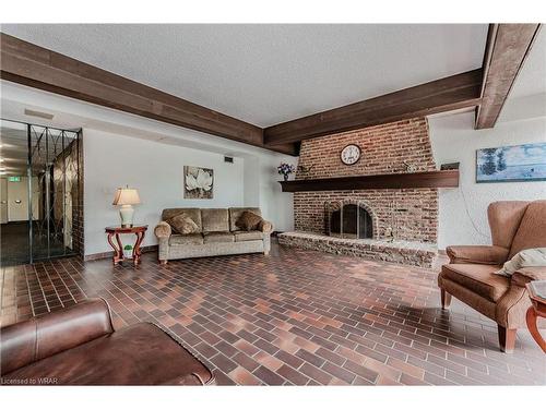 906-225 Harvard Place, Waterloo, ON - Indoor Photo Showing Living Room With Fireplace