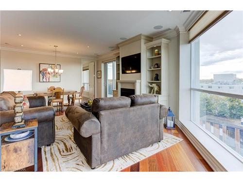 602-223 Erb Street W, Waterloo, ON - Indoor Photo Showing Living Room With Fireplace