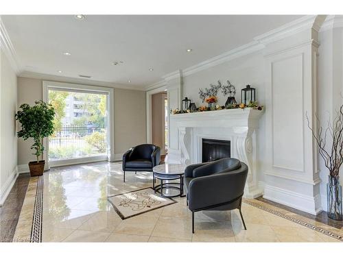 602-223 Erb Street W, Waterloo, ON - Indoor Photo Showing Living Room With Fireplace