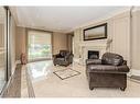 504-223 Erb Street W, Waterloo, ON  - Indoor Photo Showing Living Room With Fireplace 