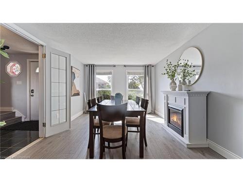 2 Santa Maria Drive, Cambridge, ON - Indoor Photo Showing Dining Room With Fireplace