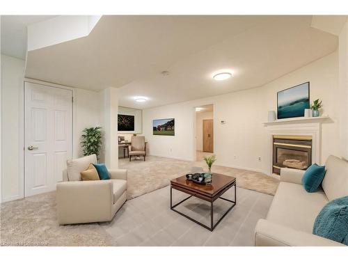 D-144 Wood Street, Brantford, ON - Indoor Photo Showing Living Room With Fireplace