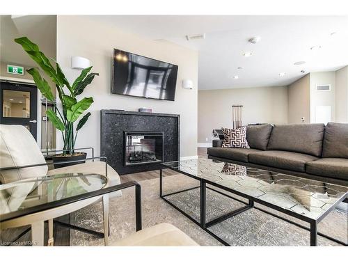 1110-155 Caroline Street S, Waterloo, ON - Indoor Photo Showing Living Room With Fireplace