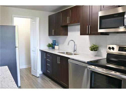 A205-100 Old Carriage Drive, Kitchener, ON - Indoor Photo Showing Kitchen With Double Sink With Upgraded Kitchen