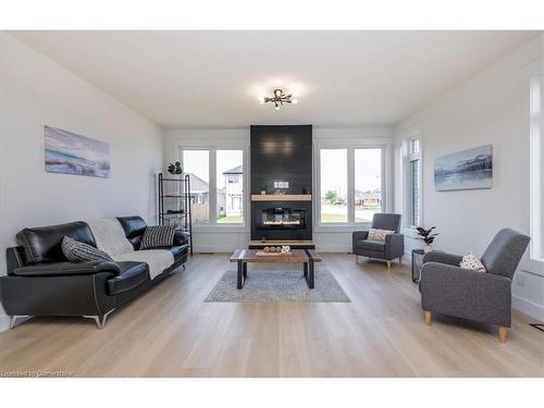 64 Allenwood Road, Elmvale, ON - Indoor Photo Showing Living Room With Fireplace