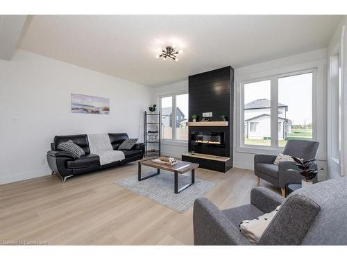 64 Allenwood Road, Elmvale, ON - Indoor Photo Showing Living Room With Fireplace