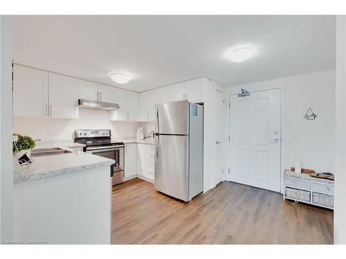 503-7 Kay Crescent, Guelph, ON - Indoor Photo Showing Kitchen With Stainless Steel Kitchen With Double Sink