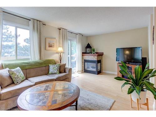 14-2651 Aquitaine Avenue, Mississauga, ON - Indoor Photo Showing Living Room With Fireplace