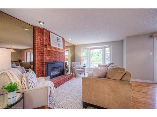 13-192 Alpine Road, Kitchener, ON - Indoor Photo Showing Living Room With Fireplace