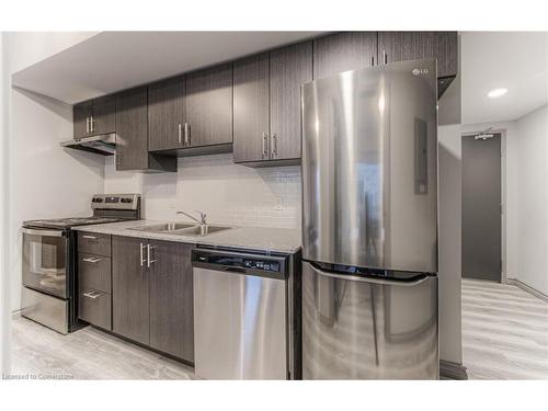 B404-275 Larch Street, Waterloo, ON - Indoor Photo Showing Kitchen With Double Sink