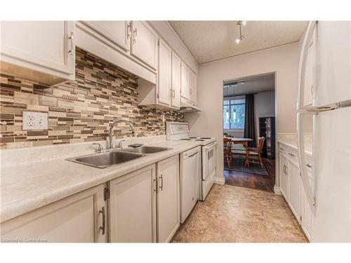 406-944 Caledonian View, Cambridge, ON - Indoor Photo Showing Kitchen With Double Sink