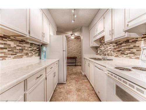 406-944 Caledonian View, Cambridge, ON - Indoor Photo Showing Kitchen With Double Sink