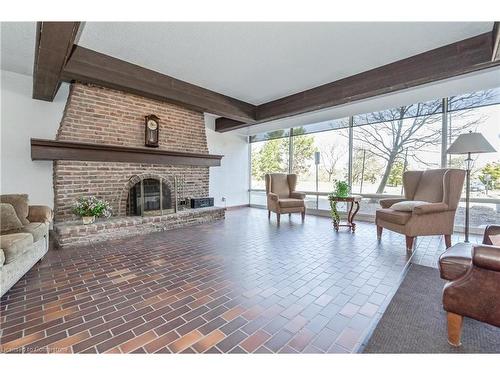 803-225 Harvard Place, Waterloo, ON - Indoor Photo Showing Living Room With Fireplace