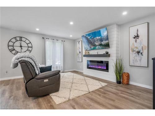 15 Miller Crescent, Simcoe, ON - Indoor Photo Showing Living Room With Fireplace