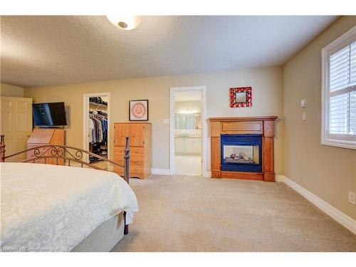 107 Cameron Street N, Kitchener, ON - Indoor Photo Showing Bedroom With Fireplace