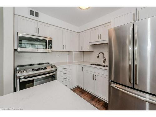 303-24 Midland Drive, Kitchener, ON - Indoor Photo Showing Kitchen With Double Sink