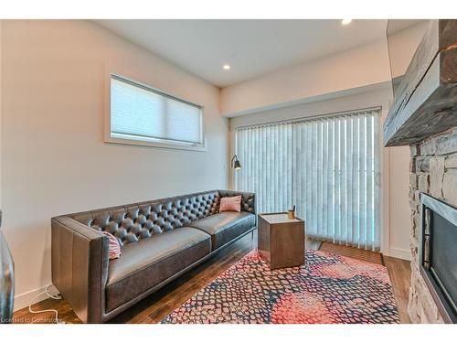 201-11 Beckwith Lane, The Blue Mountains, ON - Indoor Photo Showing Living Room With Fireplace