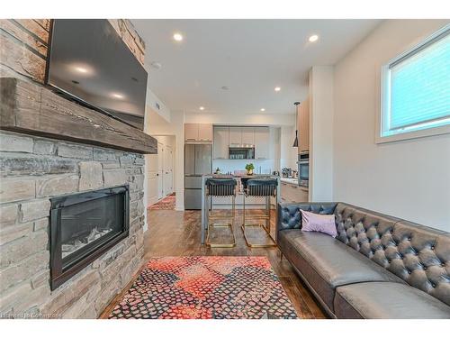 201-11 Beckwith Lane, The Blue Mountains, ON - Indoor Photo Showing Living Room With Fireplace