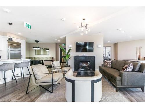 709-155 Caroline Street S, Waterloo, ON - Indoor Photo Showing Living Room With Fireplace