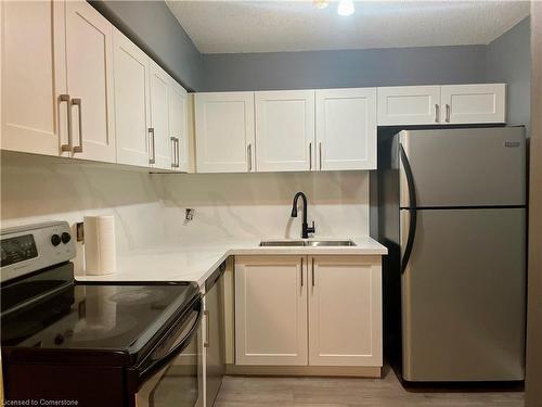 318-15 Jacksway Crescent, London, ON - Indoor Photo Showing Kitchen With Double Sink