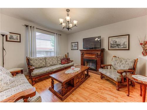 732 Grand Banks Drive, Waterloo, ON - Indoor Photo Showing Living Room With Fireplace