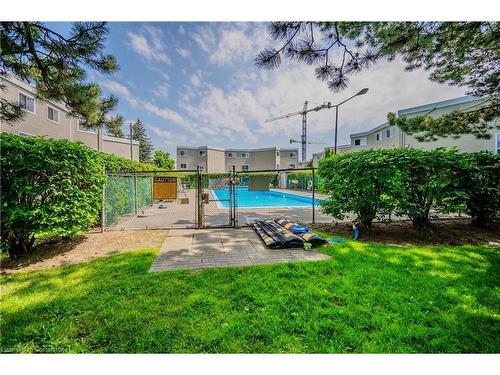 35-60 Elmsdale Drive, Kitchener, ON - Outdoor With In Ground Pool With Backyard