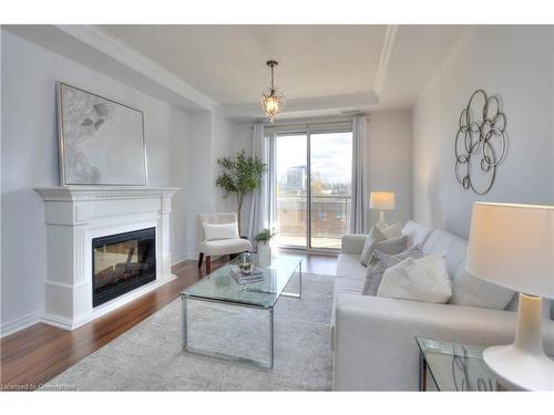 310-539 Belmont Avenue W, Kitchener, ON - Indoor Photo Showing Living Room With Fireplace