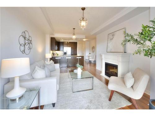 310-539 Belmont Avenue W, Kitchener, ON - Indoor Photo Showing Living Room With Fireplace