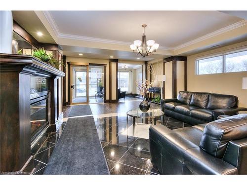 310-539 Belmont Avenue W, Kitchener, ON - Indoor Photo Showing Living Room With Fireplace