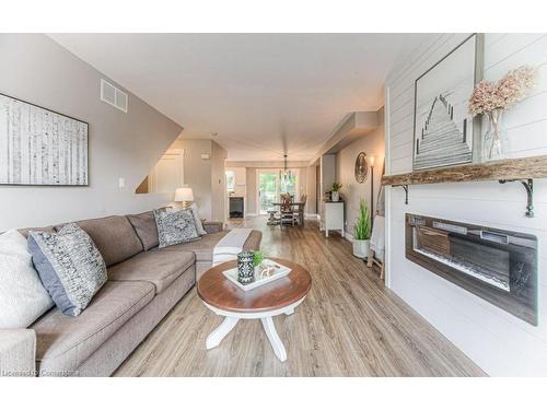 7-600 White Elm Boulevard, Waterloo, ON - Indoor Photo Showing Living Room With Fireplace