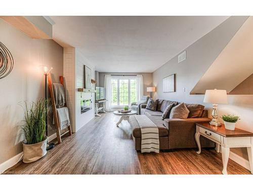 7-600 White Elm Boulevard, Waterloo, ON - Indoor Photo Showing Living Room With Fireplace