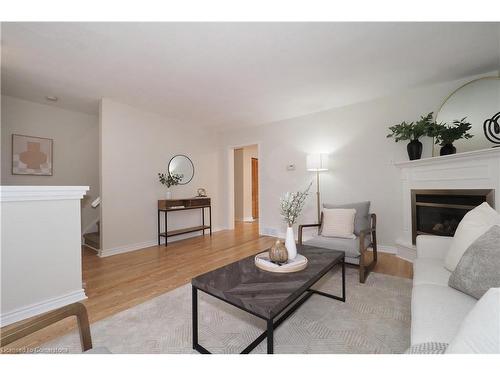 B-557 Brookhaven Crescent, Waterloo, ON - Indoor Photo Showing Living Room With Fireplace