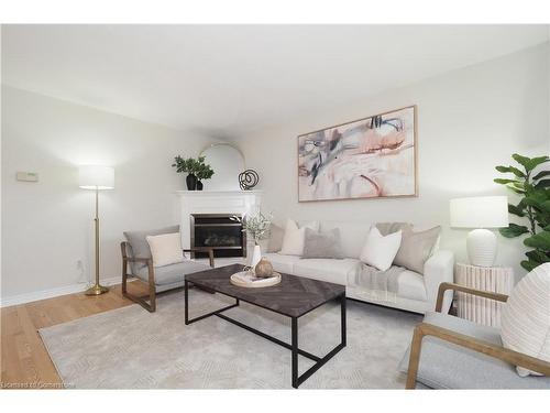 B-557 Brookhaven Crescent, Waterloo, ON - Indoor Photo Showing Living Room With Fireplace