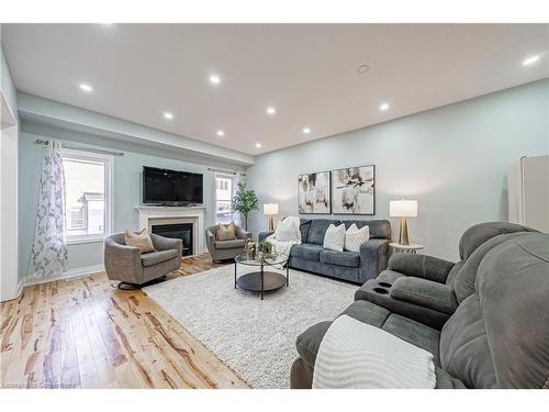 4264 Vivaldi Road E, Burlington, ON - Indoor Photo Showing Living Room With Fireplace