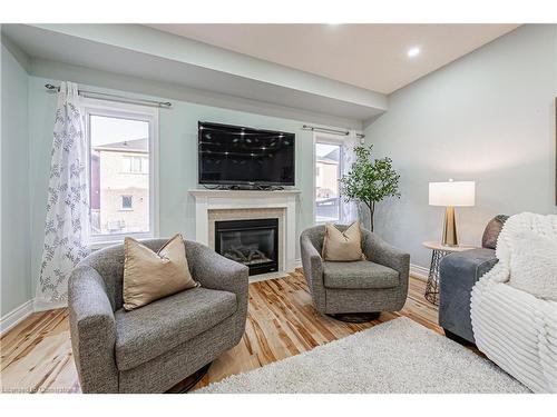 4264 Vivaldi Road E, Burlington, ON - Indoor Photo Showing Living Room With Fireplace