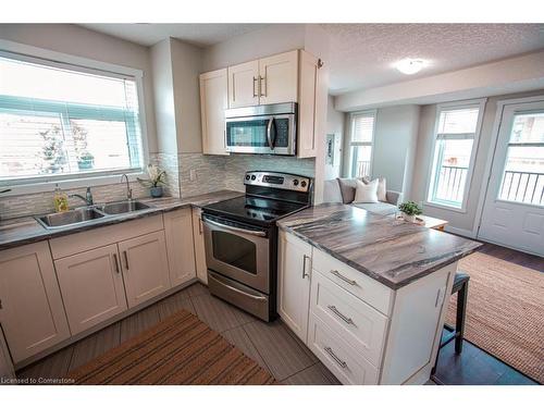 B-489 East Avenue, Kitchener, ON - Indoor Photo Showing Kitchen With Double Sink