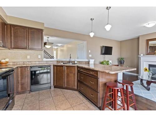 38 Manhattan Circle, Cambridge, ON - Indoor Photo Showing Kitchen With Fireplace