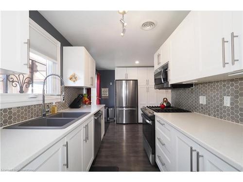 106 Keats Drive, Woodstock, ON - Indoor Photo Showing Kitchen With Stainless Steel Kitchen With Double Sink