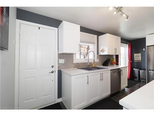 106 Keats Drive, Woodstock, ON - Indoor Photo Showing Kitchen With Double Sink