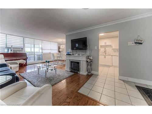 801-65 Westmount Street N, Waterloo, ON - Indoor Photo Showing Living Room With Fireplace