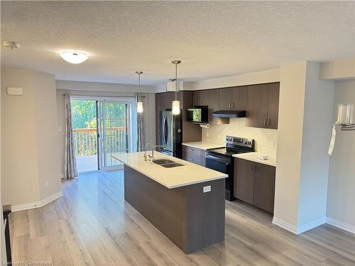 25-311 Woolwich Street, Waterloo, ON - Indoor Photo Showing Kitchen With Double Sink