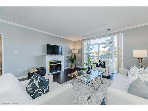 507-255 Keats Way, Waterloo, ON - Indoor Photo Showing Living Room With Fireplace