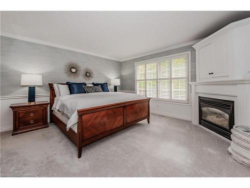 7-700 Glasgow Street, Kitchener, ON - Indoor Photo Showing Bedroom With Fireplace